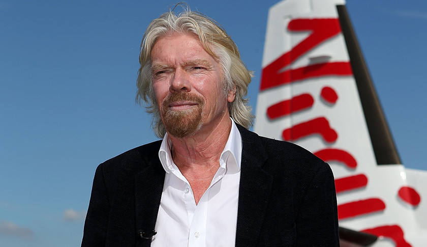 Richard Branson coi công việc là niềm vui nhưng không quên đối xử nhẹ nhàng với nhân viên của mình. Ông mua một hòn đảo ở Australia với giá 5 triệu USD, nơi bất kỳ nhân viên nào của Virgin đều có thể đến đây nghỉ miễn phí. Ảnh: Getty