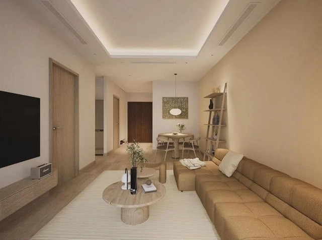 Căn nhà mang phong cách tối giản, hiện đại Wabi Sabi. Phòng khách rộng với hàng ghế sofa dài.