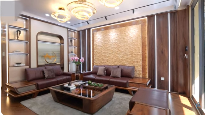 Phòng khách nổi bật với bộ sofa thiết kế theo hình chữ U, mang phong cách hiện đại.