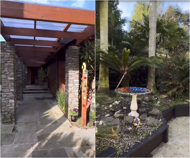 Góc vườn nhỏ được trang trí bằng các loại cây cảnh và đá.