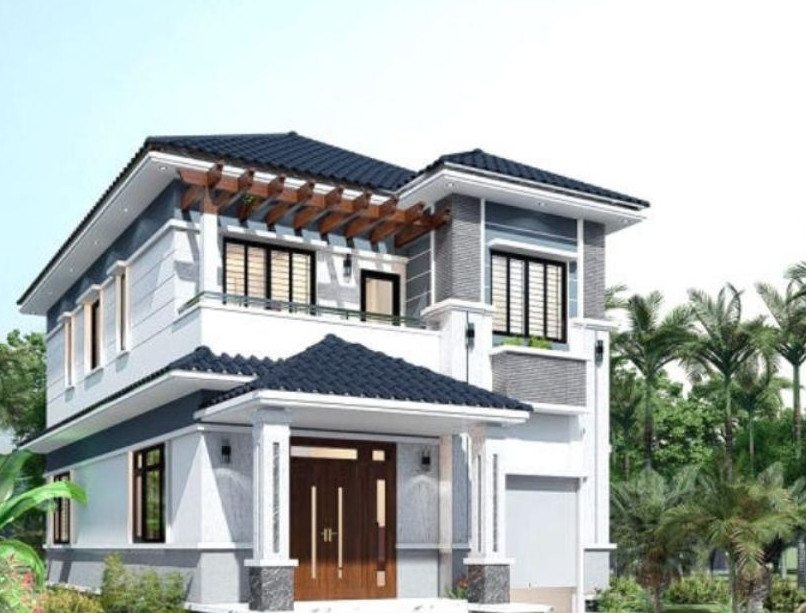 Mẫu nhà 2 tầng mái Nhật nổi bật với phần chân mái được sơn màu xanh đen. Ban công tầng 2 và xung quanh tầng 1 được bố trí cây xanh làm tăng thêm vẻ đẹp hiện đại, bắt mắt. Ảnh: Thietkenha365