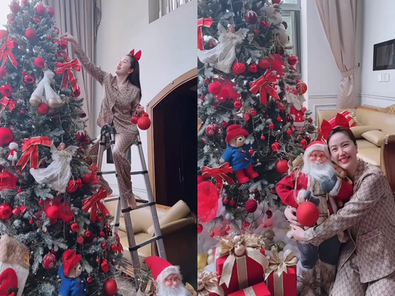 Bảo Thy cùng chồng trang trí phòng khách đón Giáng sinh. Cặp đôi đặt mua các phụ kiện trong và ngoài nước. Bảo Thy lựa chọn cây thông cao 3m, mô hình ông già Noel cao 1m. Ảnh: Phụ Nữ Mới.