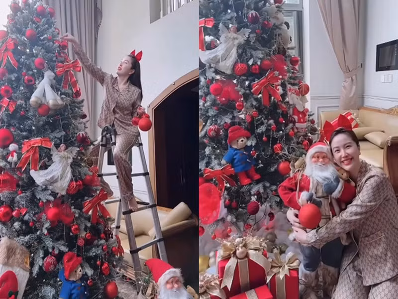 Bảo Thy cùng chồng trang trí phòng khách đón Giáng sinh. Cặp đôi đặt mua các phụ kiện trong và ngoài nước. Bảo Thy lựa chọn cây thông cao 3m, mô hình ông già Noel cao 1m. Ảnh: Phụ Nữ Mới.