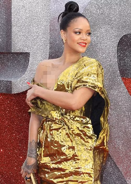 Diện bộ đầm hở bạo, giọng ca "Diamonds" liên tục chỉnh váy để tránh gặp sự cố trang phục.