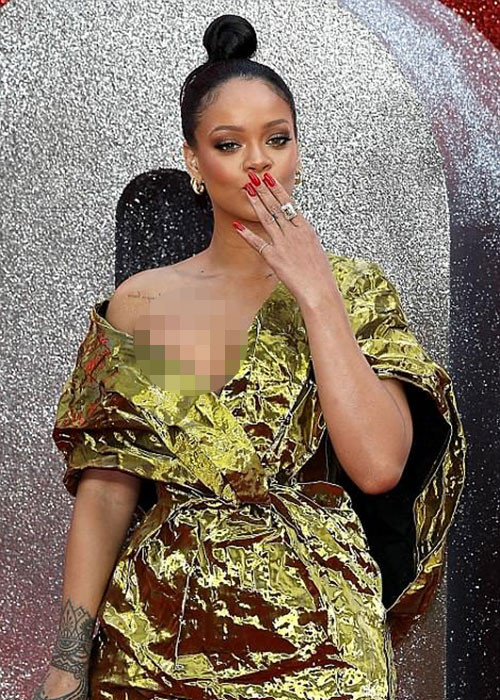 Rihanna diện chiếc váy ánh vàng trễ nải và đeo trang sức kim cương.