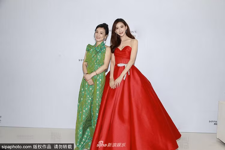 Tối ngày 20/6, Trương Đình - Lâm Chí Linh (phải) cùng tham gia một sự kiện.