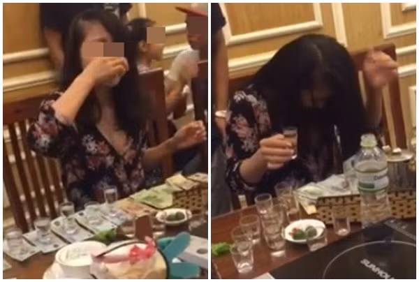 Cô gái bị ném đá khi uống 13 ly rượu trong 3 phút để nhận tiền. Ảnh cắt từ clip.