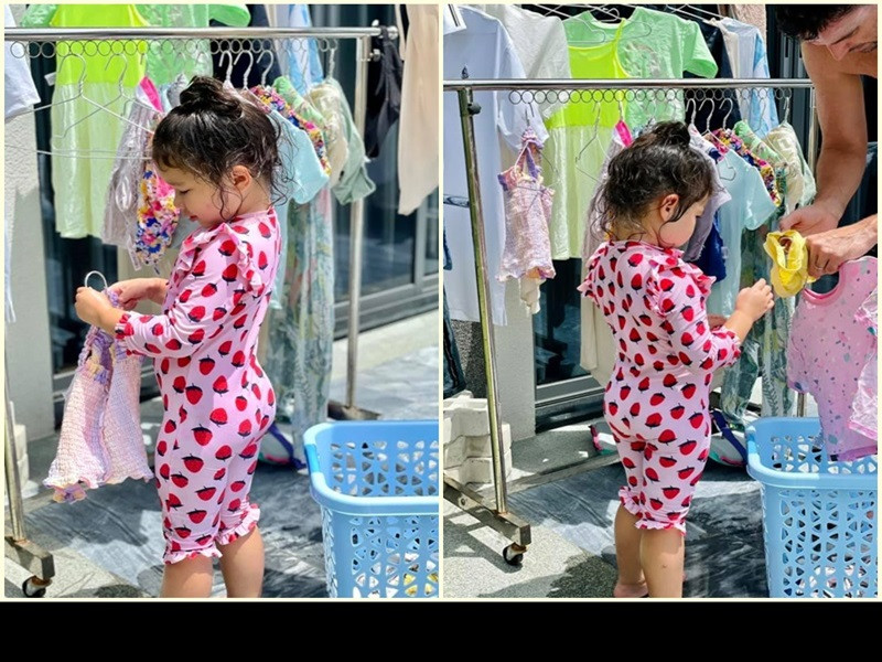 Con gái của Hà Anh tự lập dù mới 3 tuổi. Trong những ngày ở Vũng Tàu, cô nhóc phụ bố phơi quần áo.