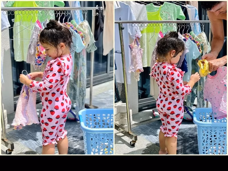 Con gái của Hà Anh tự lập dù mới 3 tuổi. Trong những ngày ở Vũng Tàu, cô nhóc phụ bố phơi quần áo.