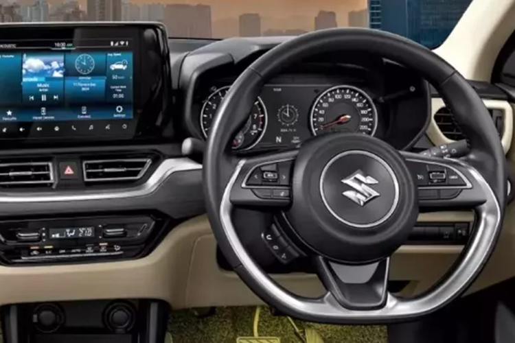 Bên trong, bảng điều khiển trông rất giống với Swift, mặc dù có một vài thay đổi trên phần trang trí, bao gồm các điểm nhấn bằng gỗ giả. Cụm đồng hồ analog được kết hợp với thông tin giải trí 9 inch, tương thích với kết nối Android Auto / Apple CarPlay không dây.