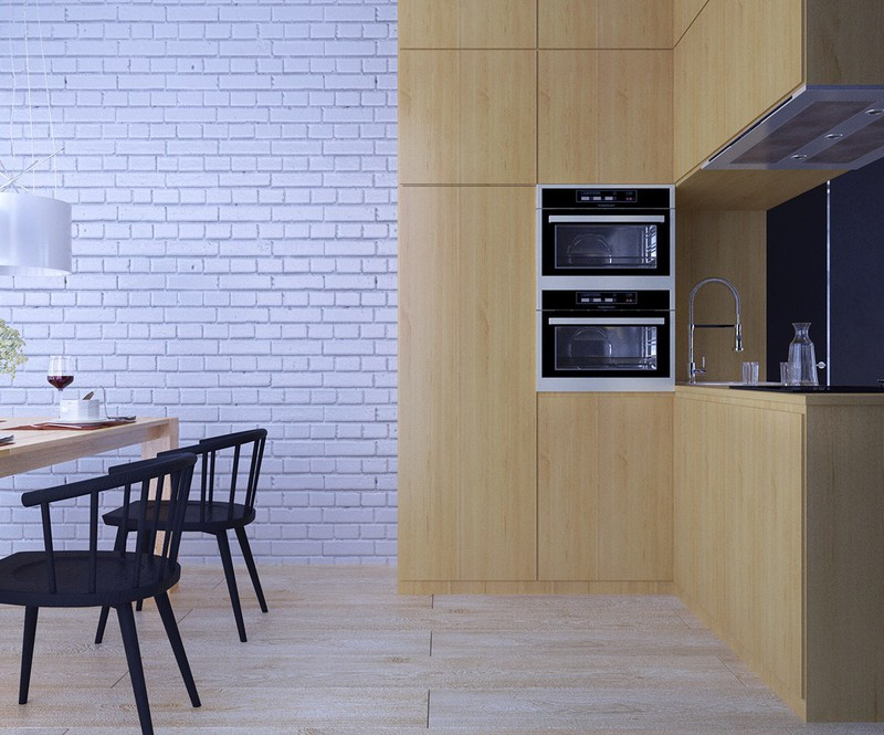 Đóng vai trò là trung tâm của ngôi nhà, nhà bếp nhỏ gọn đứng giữa phòng ăn sáng và phòng khách.