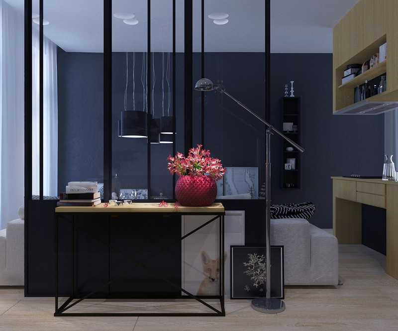 Các khu vực sinh hoạt xoay quanh một nhà bếp màu trầm tối sang trọng. Thiết kế mở mang đến cảm giác kết nối nhiều hơn giữa các thành viên trong nhà.