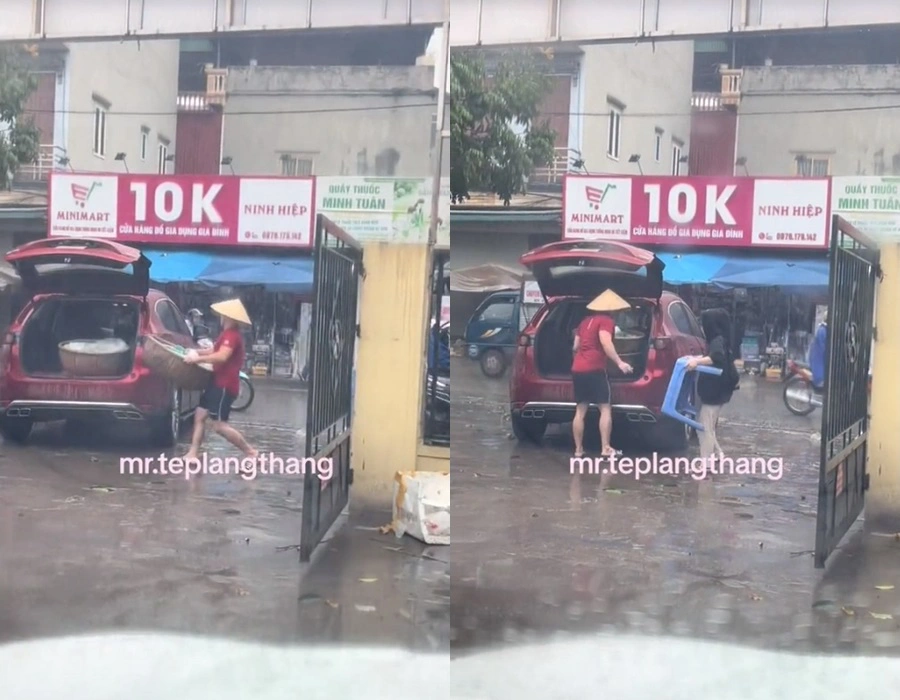 Clip đôi vợ chồng đang đội mưa, vội vã bê thúng đựng xôi, bàn ghế bỏ lên chiếc xe ô tô màu đỏ, nhãn hiệu Mazda CX-5 để về nhà khiến nhiều người không khỏi trầm trồ.