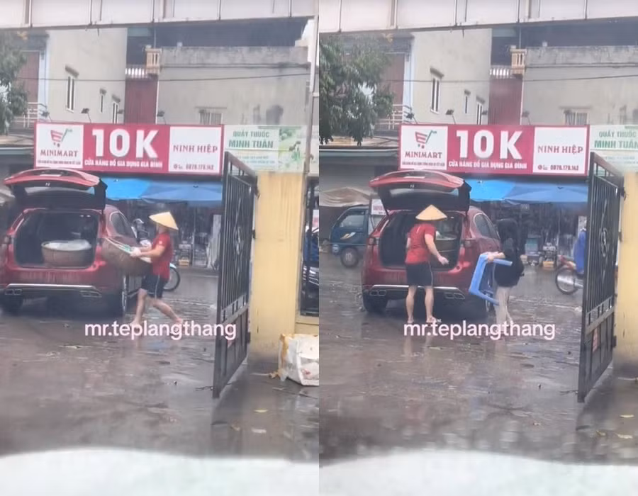 Clip đôi vợ chồng đang đội mưa, vội vã bê thúng đựng xôi, bàn ghế bỏ lên chiếc xe ô tô màu đỏ, nhãn hiệu Mazda CX-5 để về nhà khiến nhiều người không khỏi trầm trồ.