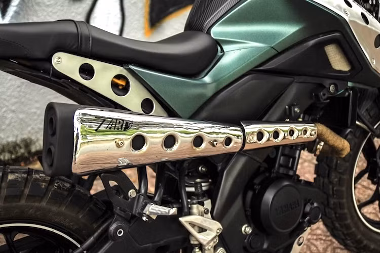 Hệ khung và động cơ nguyên bản của chiếc TFX150 không có sự thay đổi, tuy nhiên phần đuôi xe đã được tối giản với pad biển số rút gọn và yên mới với đèn hậu tích hợp. Theo đúng phong cách scrambler, chiếc xe sở hữu cây pô 2 nòng phong cách hãng ống xả Zard, với các tấm chống nóng cũng được làm từ inox dập lỗ.