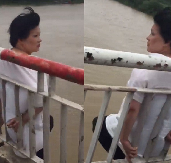 Hình ảnh người phụ nữ leo ra giữa cầu Chương Dương định tử tự.