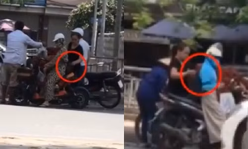 Hình ảnh đối tượng Thanh (khoanh đỏ) đang thực hiện hành vi móc túi của mình. Ảnh cắt từ clip.