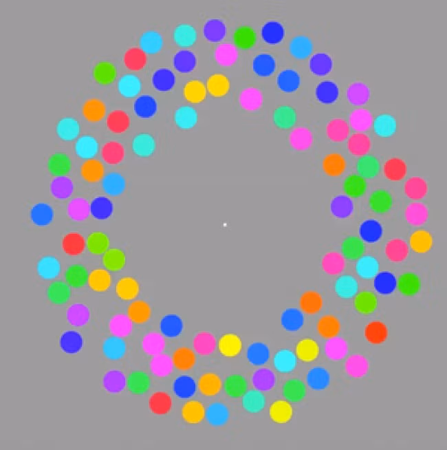 Nếu bạn nhìn vào chấm màu trắng ở giữa trong 30 giây, bạn có thể sẽ thấy những chấm màu sắc xung quanh bắt đầu thay đổi màu sắc hoặc biến mất hoàn toàn. (Nguồn Brightside)