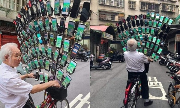 Theo The Verge, với bộ giá đỡ lớn được đặt cố định lên xe đạp, cụ ông Chen San-yuan ở Đài Loan đã mang theo bên mình 64 chiếc smartphone để thỏa mãn niềm vui "bắt thú".