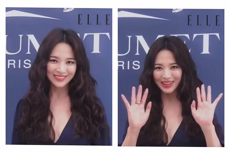 Trong video trả lời tờ Elle, Song Hye Kyo vẫy chào fan và luôn nở nụ cười trên môi.