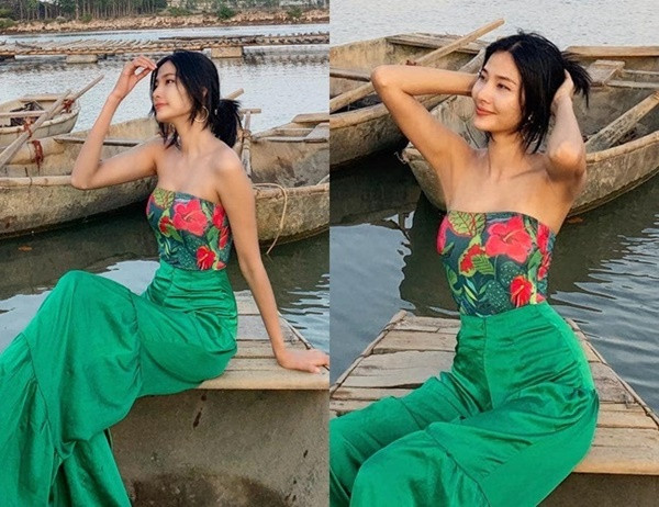 Hoàng Thùy diện áo quây gợi cảm tôn vòng một căng đầy tạo dáng trên biển.