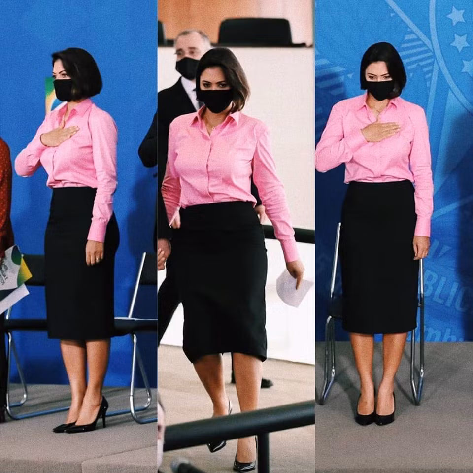 Bà Michelle trông cực kỳ trẻ trung khi diện sơ mi hồng mix cùng chân váy đen sang trọng. Ảnh: FB, Internet. Mời độc giả theo dõi video "Minh Hằng chia sẻ về phong cách thời trang". Nguồn: VTC.