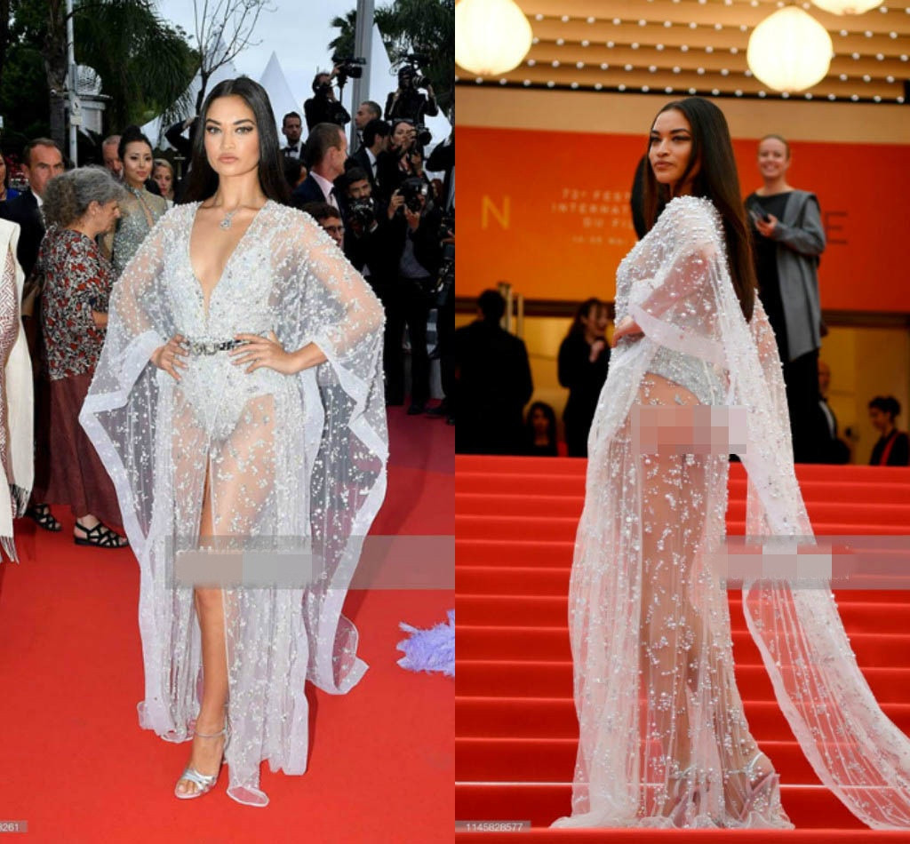 Chân dài Shanina Shaik gây náo loạn thảm đỏ Cannes 2019 vì khoe vòng 3 lộ liệu trong bộ đồ được nhận xét chẳng khác nào đồ bơi.