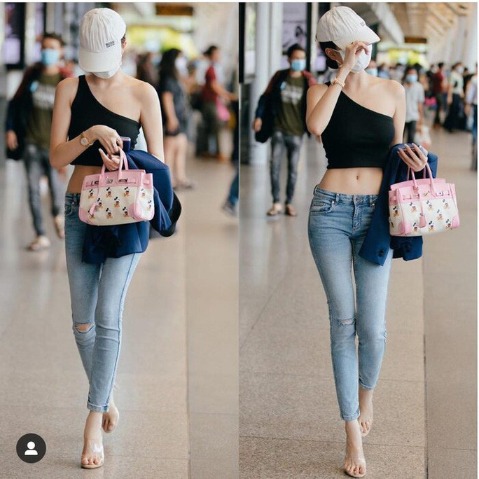 Thân hình nuột nà của Ngọc Trinh khi diện quần jeans kết hợp với chiếc áo đen kiểu dáng ôm sát đường cong khoe khéo vòng eo thon gọn.