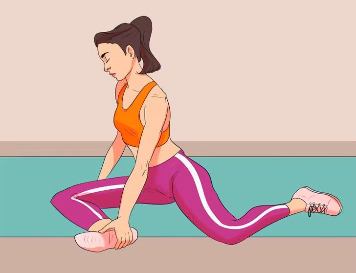 Kéo giãn 90/90: Động tác giảm cân này giúp thư giãn cơ lưng và hông, phù hợp cho người phải ngồi nhiều. Ngồi thẳng lưng, nghiêng người sang hải, chân phải gập 90 độ, đặt nghiêng trên thảm, chân trái gập 60 độ, mũi chân úp xuống thảm. Tay phải đặt chống xuống phía sau lưng, tay trái nắm lấy bàn chân phải. Giữ tư thế trong 30 giây rồi đổi bên. Lặp lại động tác 10 lần.