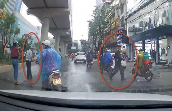 Co gai danh roi tien, 2 nguoi dan ong bat chap xe co lao ra hoi cua