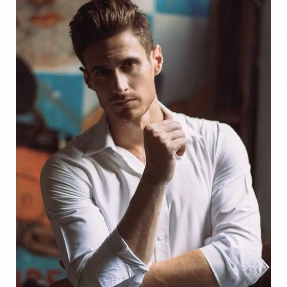 Trước đó Dustin Cheverier có thời gian dẫn chương trình "Follow Us" cùng Khánh Vy trên VTV7, từng lọt top đề cử Chương trình hay nhất của VTV Awards 2018.