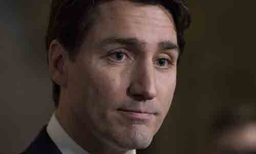 Thủ tướng Canada Justin Trudeau trả lời báo chí tại phòng họp của Hạ viện sau khi báo cáo đạo đức được công bố tại Ottawa hôm 20/12 kết luận ông vi phạm các quy tắc mâu thuẫn lợi ích khi đi nghỉ Giáng sinh tại đảo ở Bahamas thuộc sở hữu của Aga Khan vào năm ngoái. Ảnh: AP.