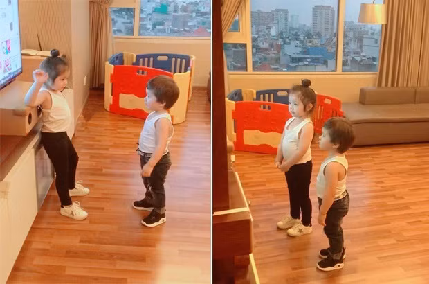 Một góc phòng khách có cửa sổ lớn và view nhìn ra thành phố.