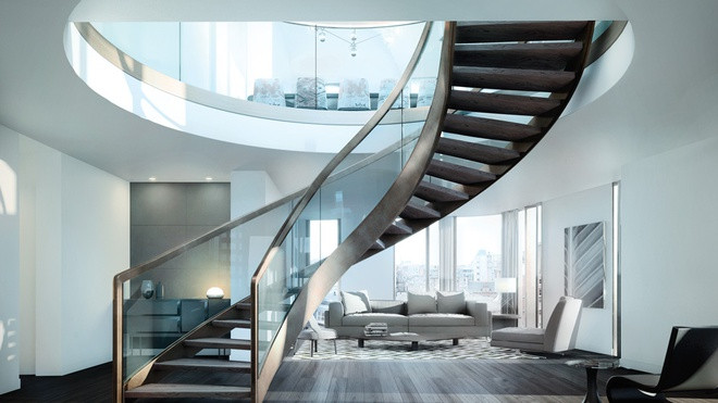 Cầu thang uốn lượn duyên dáng dẫn đến những không gian tiếp khách khác nhau bên trong ngôi nhà. Các ô cửa kính cỡ lớn đem đến ánh sáng tự nhiên và cảnh sắc thành phố.