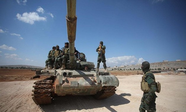 Theo Sputnik, phiến quân Jaysh Al-Izza đang "hợp sức" cùng lực lượng Đảng Hồi giáo Turkistan (TIP) chống lại Quân đội Syria ở vùng Đông Bắc Latakia và Tây Bắc Hama. Ảnh: ET.