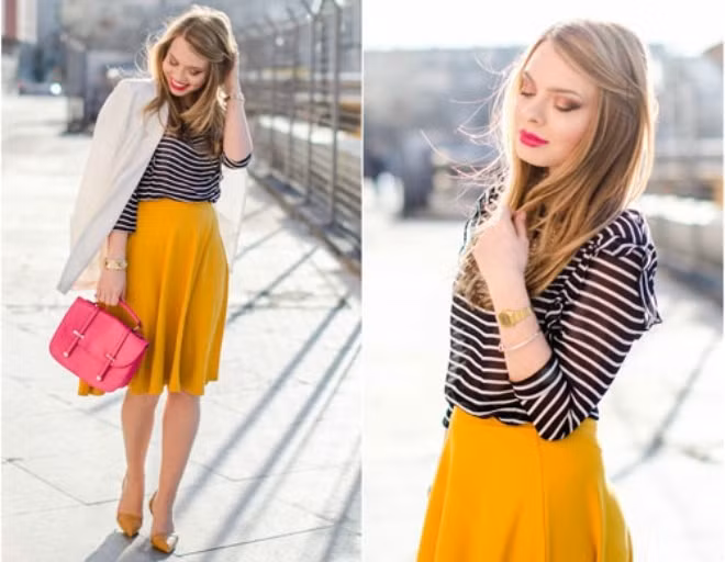 Chiếc váy màu vàng có thể phối cùng áo thun kẻ ngang đen trắng. Đây là một trong những cách phối đồ với chân váy midi đơn giản và hiệu quả.