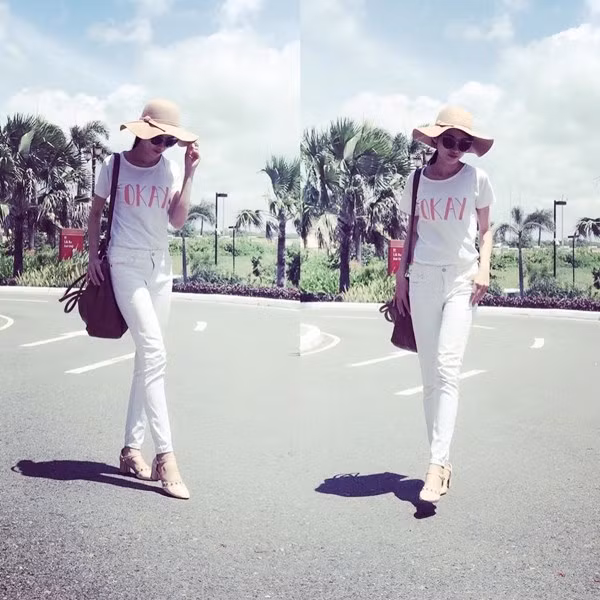 Chế Nguyễn Quỳnh Châu mix white-on-white (tuyền trắng) đơn giản mà hiệu quả. Các phụ kiện kính mắt, mũ rộng vành hay túi đeo cỡ lớn cũng làm cá tính cô nàng thêm nổi bật.