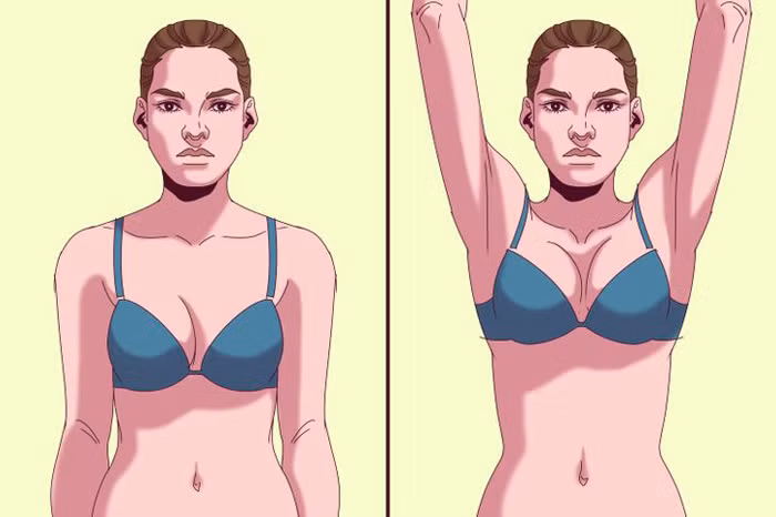 Bước 2 – Giơ cánh tay lên cao để kiểm tra xem có dịch chảy từ núm vú hay không.