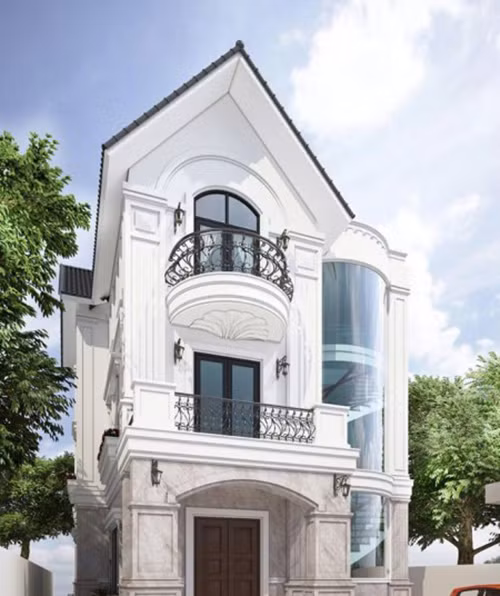 Tầng 1 của căn biệt thự được ốp lát toàn bộ bằng đá ốp lát tự nhiên. Phần ô kính che chắn cầu thang vừa có tác dụng trang trí vừa có tác dụng lấy ánh sáng tự nhiên cho căn nhà. Ảnh: Vtkong.