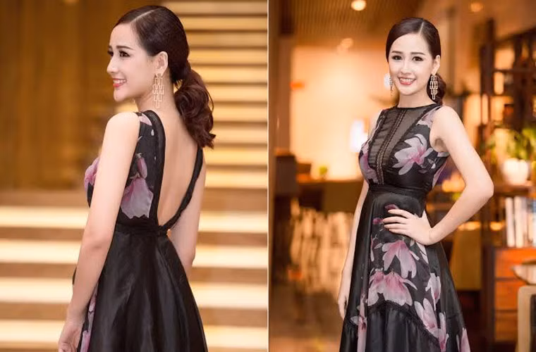 Mái tóc được cột gọn gàng, khuôn mặt trang điểm nhẹ nhàng nhưng sắc nét, Mai Phương Thúy chọn chiếc váy voan đen in hoa màu hồng rất sang trọng và bắt mắt.