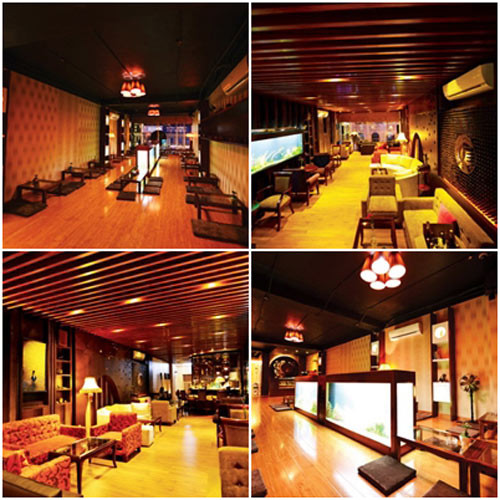 Không gian tiếp khách, trò chuyện cùng bạn bè của Mỹ Tâm mang hơi thở Châu Á hơn, trần nhà được ốp gỗ, ánh đèn vàng tạo cảm giác gần gũi, ấm cùng.