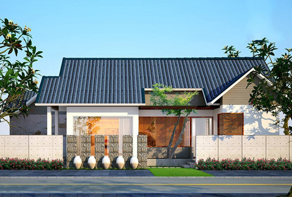 Mang phong cách nghỉ dưỡng, nhà cấp 4 mái thái nổi bật với tường cổng cách điệu, các bình gốm và đá ốp cầu kỳ. Ảnh: Musk