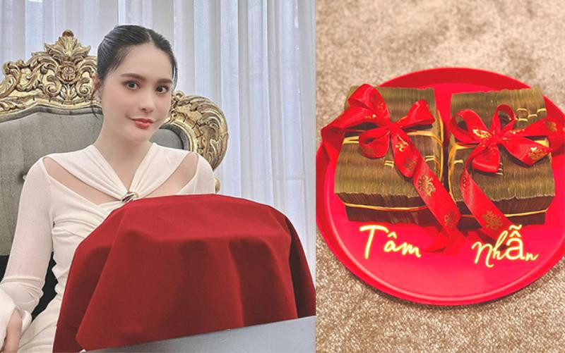 Ngoài ra, Đoàn Di Băng còn gây "choáng" khi trao quà cưới cho Thiên Kim gồm: Váy cưới trị giá 160 triệu; gói trang trí cho tất cả tiệc, lễ gia tiên, lễ trang trí xe hoa, trang trí xe hơi 2 tỷ; kỳ trăng mật tại Hong Kong trị giá 100 triệu; mâm lộc nguyên tiền mặt 200 triệu. Nguồn ảnh: FBNV