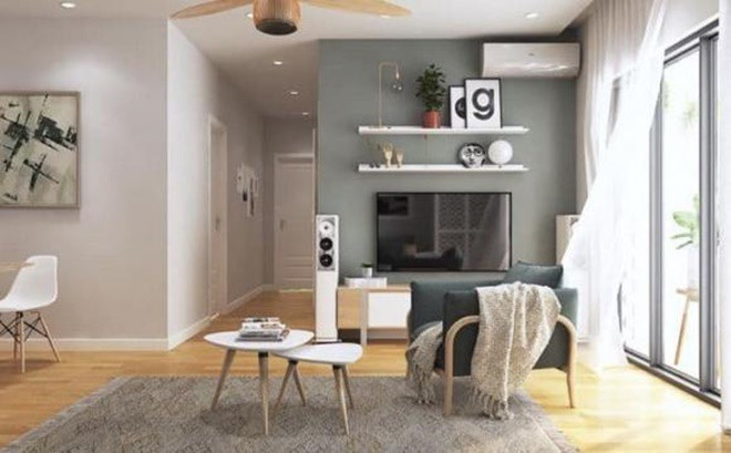 Không gian phòng khách thoáng đãng, tận dụng ánh sáng tự nhiên từ ban công qua cửa kính.