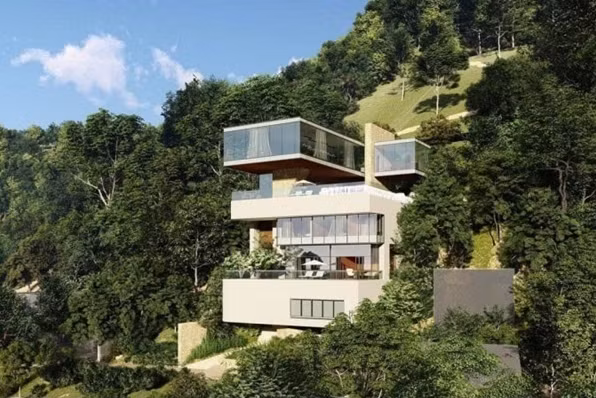 Căn biệt thự nằm bình yên giữa rừng, view biển và ba mặt kính đón sáng.