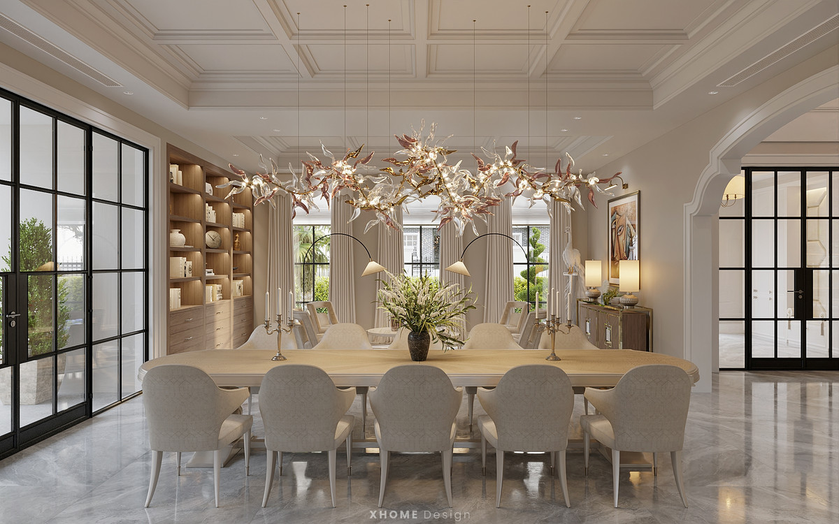 Bàn ăn lớn bố trí cạnh cửa kính đón ánh sáng tự nhiên.