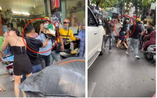 Người phụ nữ giật cửa xe để lôi cô gái trẻ xuống đường, sau đó liên tục chửi bới lớn tiếng và giật tóc, đánh đập tình địch rất mạnh tay.