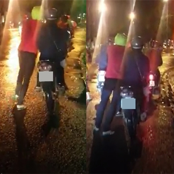 Đáng chú ý, bên cạnh cặp đôi còn có một người bạn khác đang đi xe máy chậm bên cạnh. Nhiều người cũng thắc mắc tại sao bạn nữ không chuyển sang xe của người bạn kia ngồi để bạn trai không phải dắt nặng.
