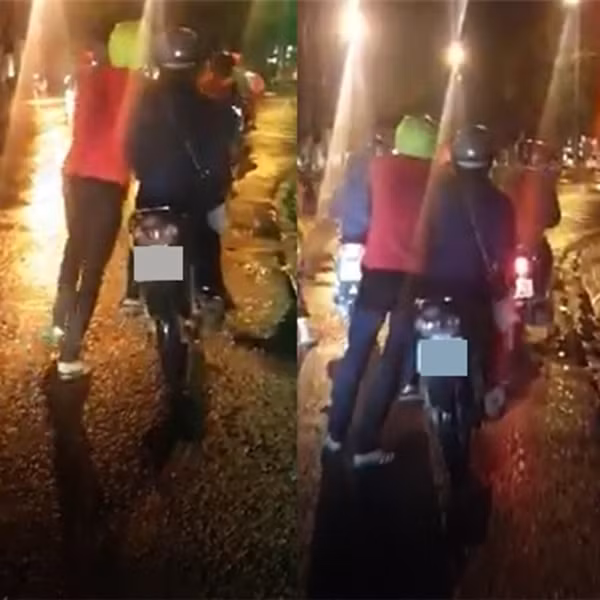 Đáng chú ý, bên cạnh cặp đôi còn có một người bạn khác đang đi xe máy chậm bên cạnh. Nhiều người cũng thắc mắc tại sao bạn nữ không chuyển sang xe của người bạn kia ngồi để bạn trai không phải dắt nặng.