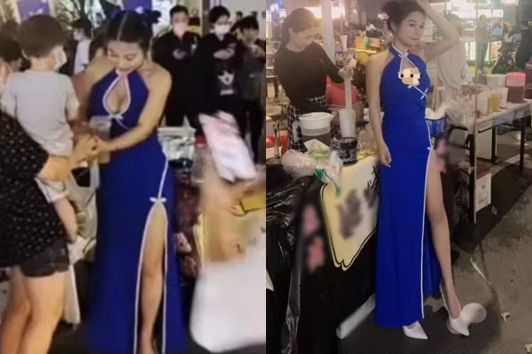 Theo đó, trong những hình ảnh/clip được chia sẻ trên mạng xã hội cô gái này diện sườn xám màu xanh cổ yếm với điểm cut-out táo bạo, phần chân váy xẻ tà cao khoe chân dài.